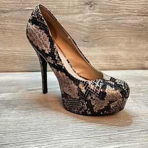 Olsenboye tall platform snakeskin patterned high heels. Closed toe size 9
